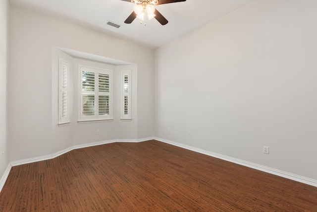 empty room featuring hardwood / wood-style floors and ceiling fan