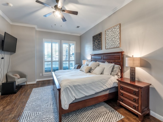 bedroom with ceiling fan, ornamental molding, and dark hardwood / wood-style flooring