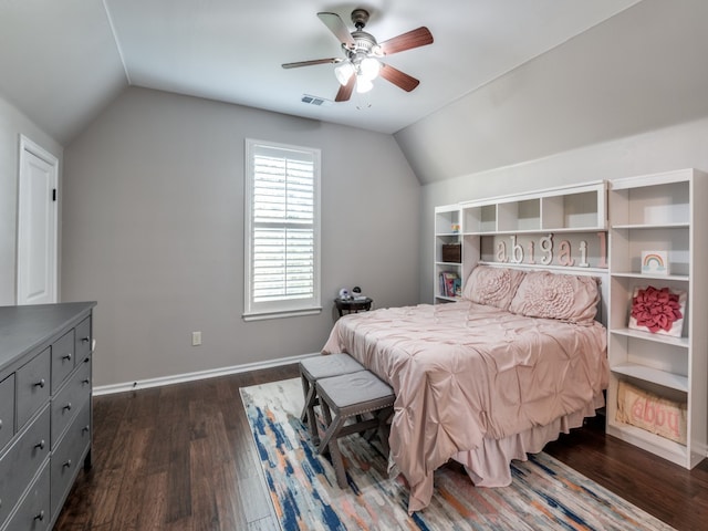 bedroom with ceiling fan, lofted ceiling, and dark hardwood / wood-style flooring