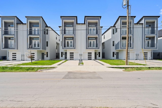 2507 Crossman Ave, Dallas, TX 75212 - view of building exterior with concrete driveway and a garage