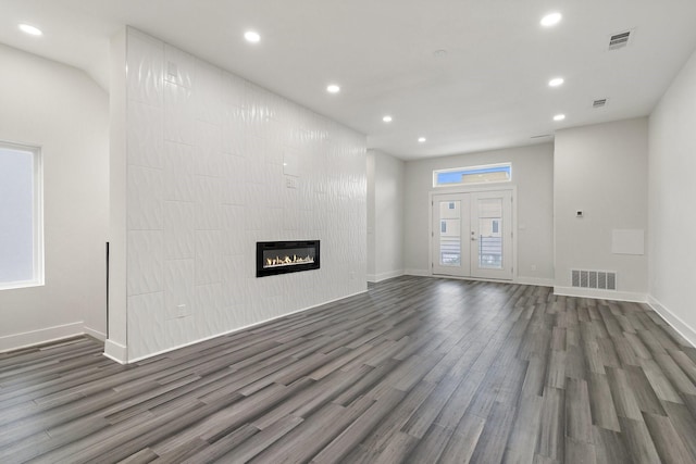 2507 Crossman Ave, Dallas, TX 75212 - unfurnished living room with dark wood-style flooring, recessed lighting, baseboards, and a fireplace