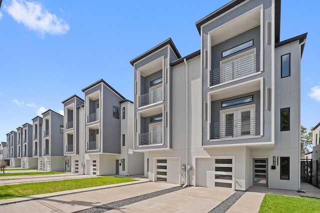 view of front of house featuring a balcony