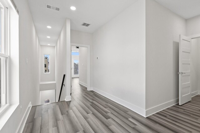 hall with hardwood / wood-style flooring