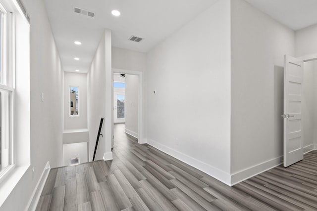 2507 Crossman Ave, Dallas, TX 75212 - corridor with an upstairs landing, wood finished floors, recessed lighting, and baseboards