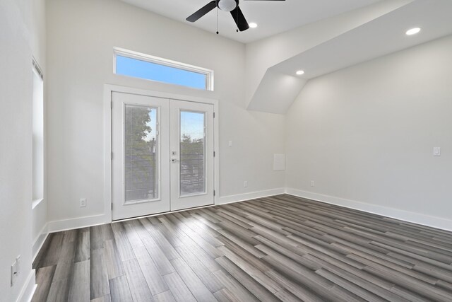 unfurnished room with french doors, dark hardwood / wood-style floors, and ceiling fan