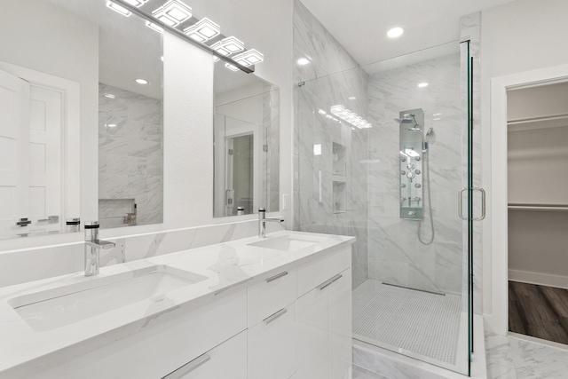 2507 Crossman Ave, Dallas, TX 75212 - full bathroom with a marble finish shower, marble look tiles, recessed lighting, a spacious closet, and double vanity
