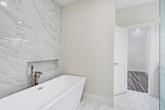 2507 Crossman Ave, Dallas, TX 75212 - full bath with marble finish floors, a soaking tub, and baseboards