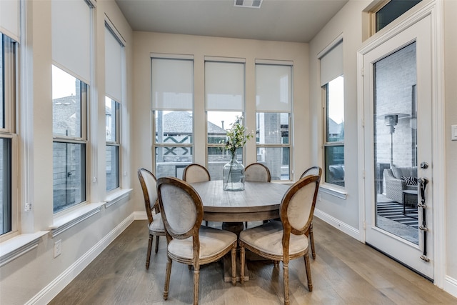 dining area featuring hardwood / wood-style floors