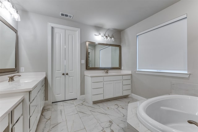 bathroom featuring vanity and a bathing tub