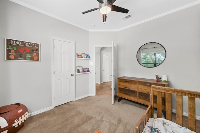 carpeted bedroom with ceiling fan and crown molding