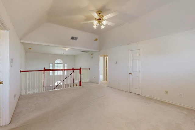 unfurnished room with ceiling fan and light colored carpet