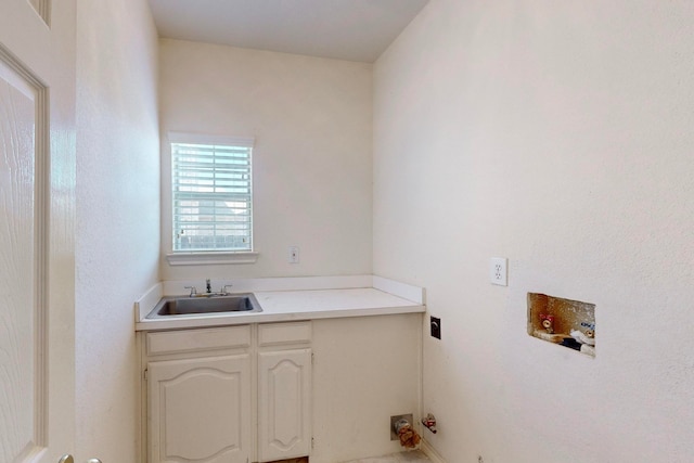 laundry area with hookup for a washing machine, sink, and hookup for an electric dryer