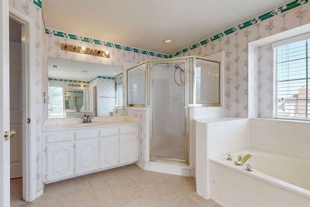 bathroom featuring tile patterned flooring, vanity, and independent shower and bath