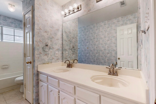 full bathroom featuring shower / bath combination, vanity, tile patterned flooring, and toilet