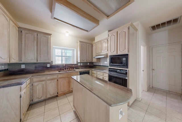 kitchen featuring decorative backsplash, black appliances, a kitchen island, and light tile patterned floors