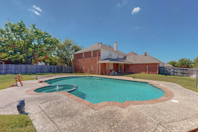 view of swimming pool featuring a lawn and a patio area