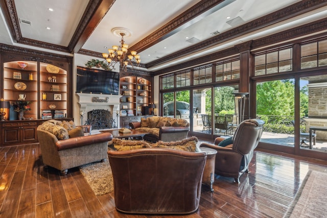 living room with an inviting chandelier, crown molding, dark hardwood / wood-style flooring, and beam ceiling