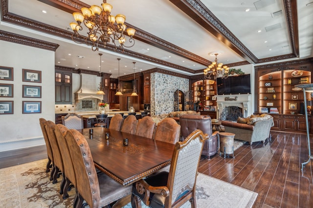 dining room with dark hardwood / wood-style floors, crown molding, and an inviting chandelier