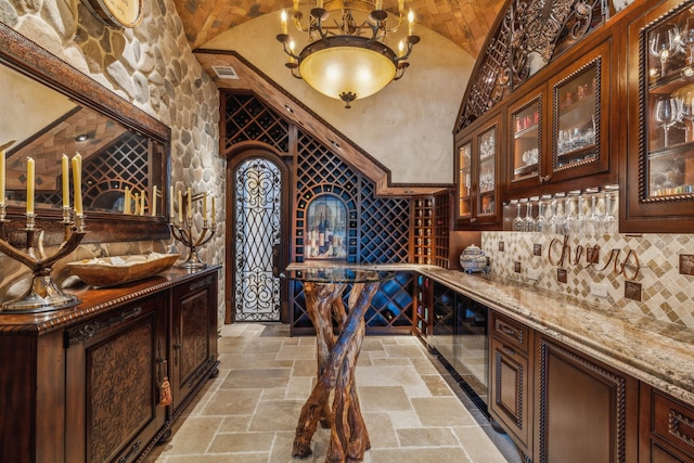 wine cellar with lofted ceiling