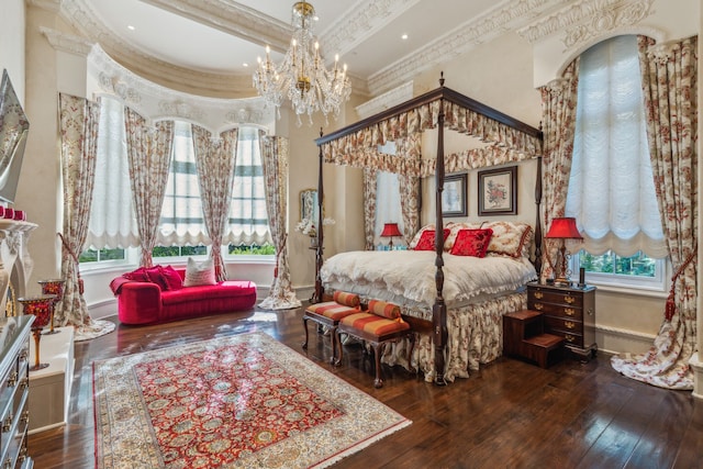 bedroom with beamed ceiling, multiple windows, crown molding, and dark hardwood / wood-style floors