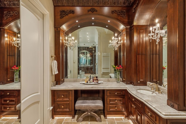 bathroom with radiator and vanity