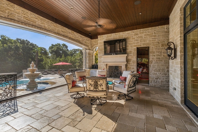 view of patio / terrace featuring an outdoor fireplace