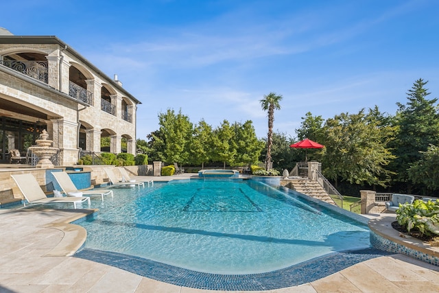 view of swimming pool with a patio area