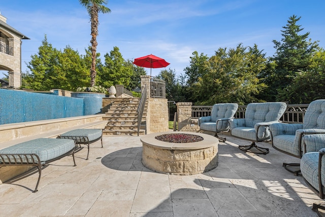 view of patio featuring an outdoor fire pit