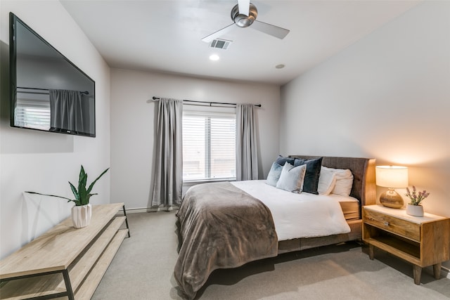 bedroom featuring ceiling fan and light colored carpet