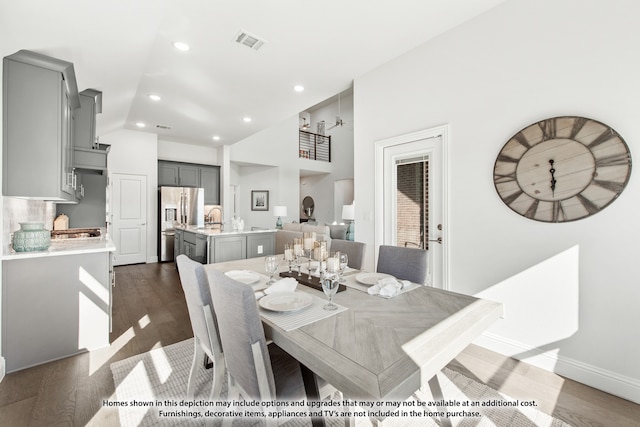 dining space with sink and dark hardwood / wood-style flooring