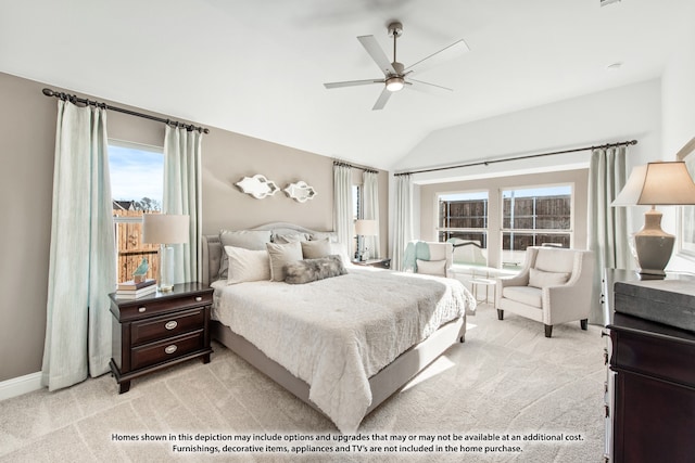 carpeted bedroom with ceiling fan and lofted ceiling