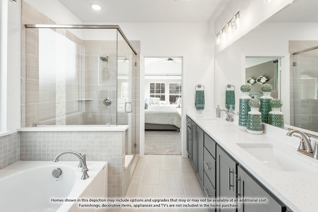 bathroom featuring vanity, plus walk in shower, and tile patterned flooring