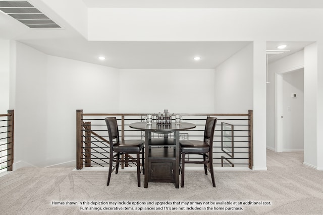 dining area with light colored carpet