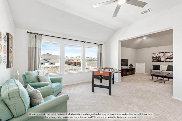 recreation room with lofted ceiling, ceiling fan, and light colored carpet