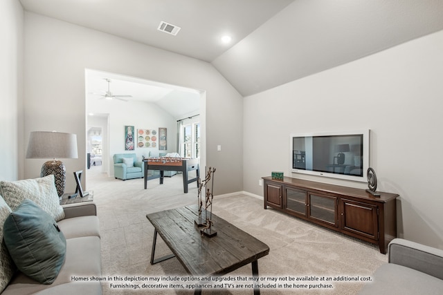 carpeted living room featuring lofted ceiling and ceiling fan