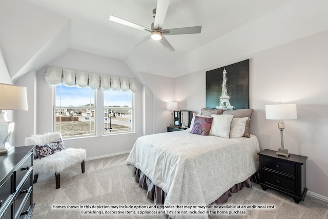 carpeted bedroom with ceiling fan and vaulted ceiling