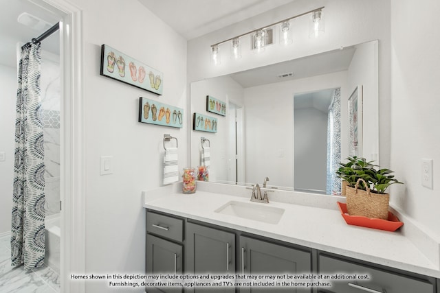 bathroom featuring shower / tub combo and vanity