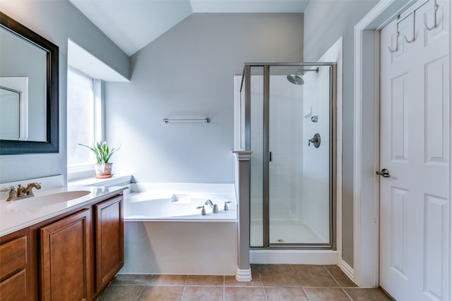 bathroom featuring vanity, plus walk in shower, tile patterned flooring, and lofted ceiling