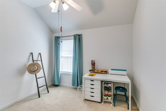 office area featuring ceiling fan, vaulted ceiling, and light colored carpet