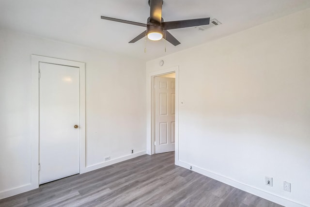 unfurnished bedroom featuring light hardwood / wood-style floors and ceiling fan