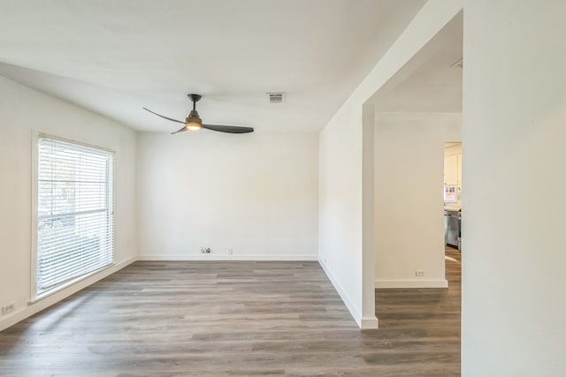 spare room featuring ceiling fan and wood-type flooring