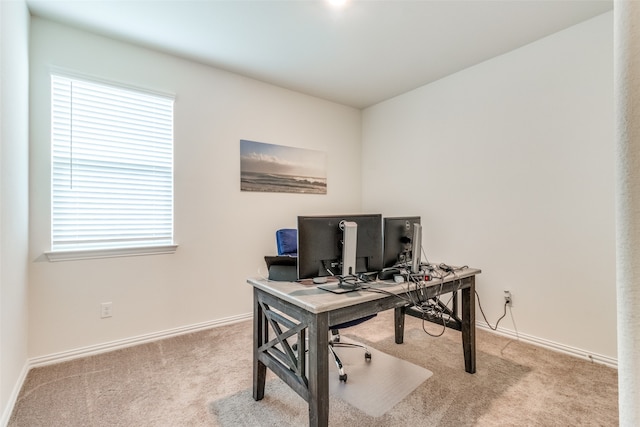 home office with plenty of natural light and carpet