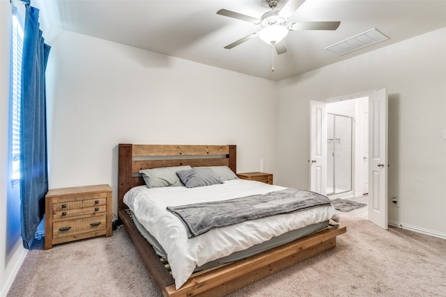 bedroom with ceiling fan and light colored carpet