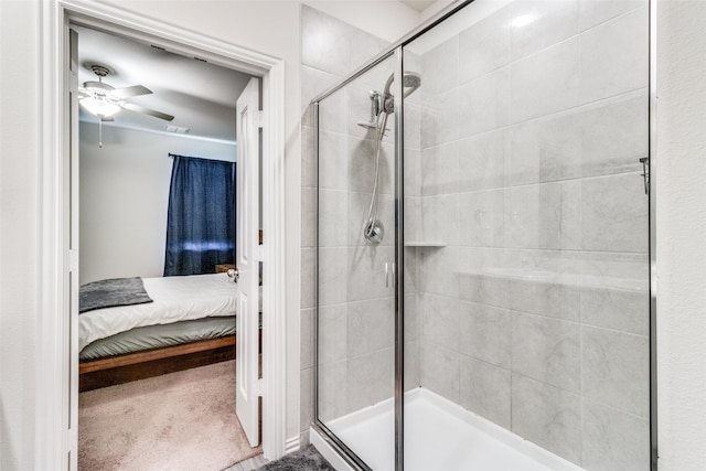 bathroom featuring ceiling fan and an enclosed shower