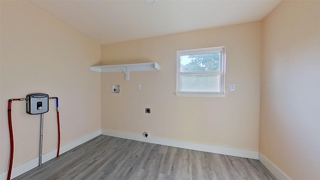 washroom featuring washer hookup, hookup for an electric dryer, and wood-type flooring