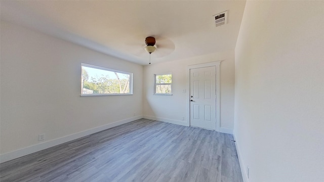 empty room featuring light hardwood / wood-style flooring and ceiling fan