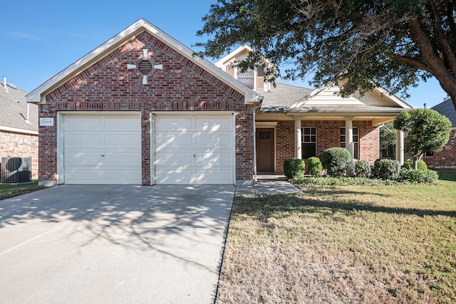 view of property with cooling unit, a front lawn, and a garage