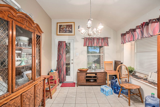 tiled dining room with an inviting chandelier and vaulted ceiling