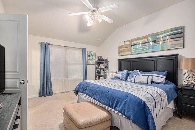 carpeted bedroom featuring ceiling fan and vaulted ceiling