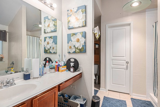 bathroom featuring vanity, a shower with curtain, toilet, and tile patterned flooring